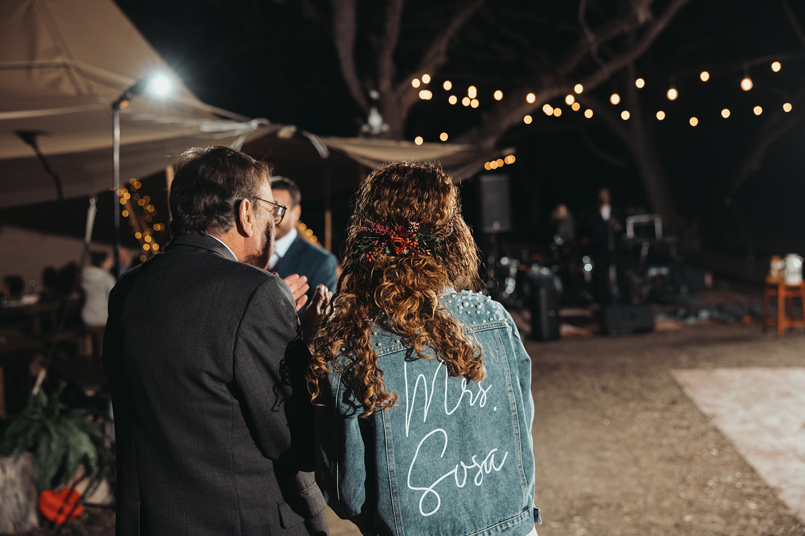 Late-night dancing under string lights at an Elm Pass Woods wedding by GR Weddings