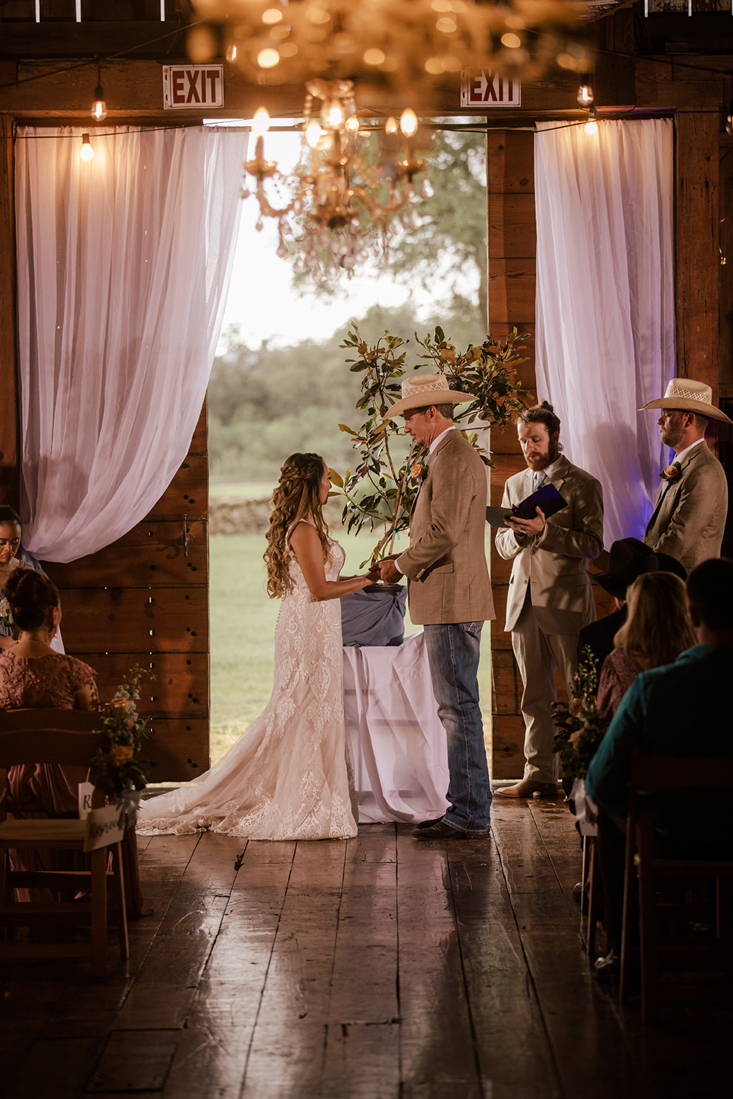Ceremony inside the barn at The 1850 Settlement near San Antonio by GR Weddings