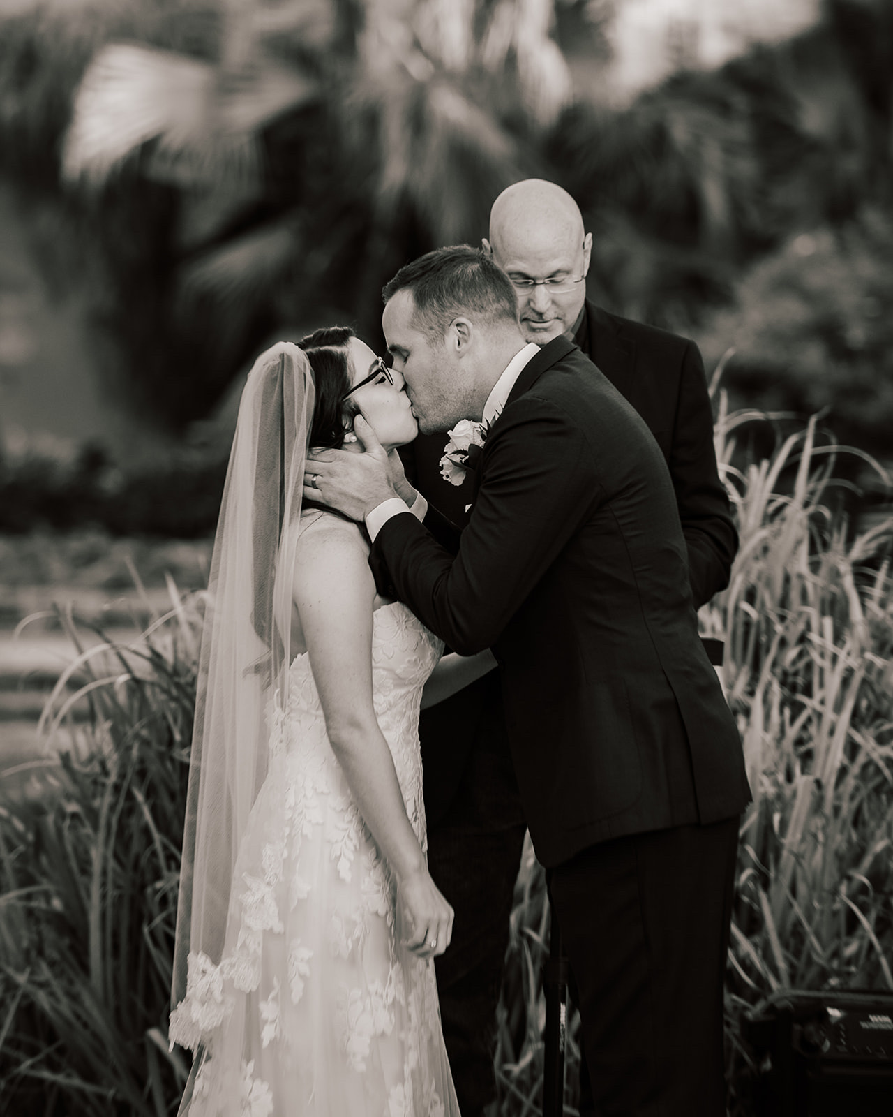 Couple's first kiss in the gardens at the San Antonio Botanical Garden by GR Weddings